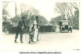 Street sweepers with gas masks in Mecca Day parade, The University of Iowa, 1920s
