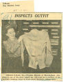 Inspects outfit