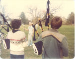 Scottish Highlanders field practice led by drum major Mark Isaacs, The University of Iowa, October 1980