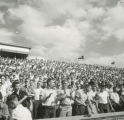 Spectators watching the Homecoming football game, 1954