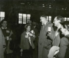 Alumni enjoying refreshments at the Homecoming Alumni Luncheon, 1954
