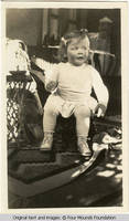 Vidie seated on little chair