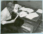 Researcher with slide rule