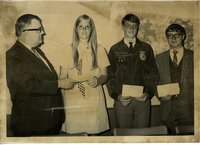 Young woman receiving award