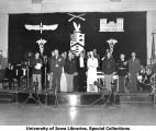 Honorary Cadet Colonel Majorie Campbell on stage at military ball, The University of Iowa, 1950