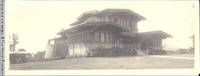 John V. Rider in front of his home in California