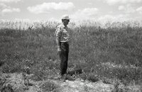Man stands in grassy field