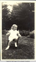 Vidie Burden sitting in chair in garden