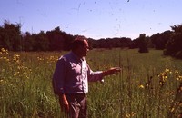Eric Hoien Poses in Native CRP Field.
