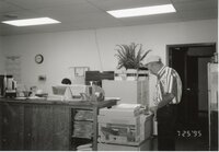 1995  John Horan stands at the photocopy machine