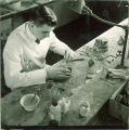 Dental student making a model, The University of Iowa, 1940s