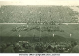 Marching band performing at football game on Dad's Day, The University of Iowa, 1940s