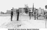 Governor's Day ceremony, woman accepting colors, The University of Iowa, 1931