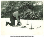 Skier on Pentacrest hill, The University of Iowa, 1940s
