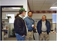 2003  Gerald Fosdick, NRCS District Conservationist Terrance Rudolph, and Extension Director Don Buzzingham chat in the office