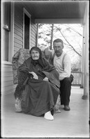 UP528 Two people on porch