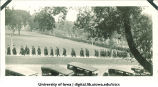 Commencement procession walking west down Washington Street and north on Madison Street, The University of Iowa, June 1928