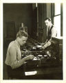 Engineering students with electrical device, The University of Iowa, 1940s