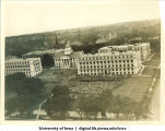 Commencement in front of MacLean Hall on the Pentacrest, with Jessup Hall to the left and the Old Capitol in background, The University of Iowa, 1910s