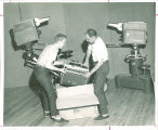 Movers unpack television equipment for television studio, The University of Iowa, 1955