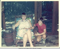 Frindy and John, Jr. sitting in screened in porch 
