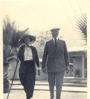Aunt Van and Uncle Maurice walking near palm trees