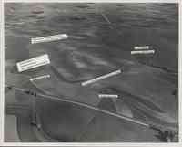 Aerial view of farmland showing strip cropping, terracing, contouring, waterways, grasslands and minimum tillage.