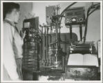 Researcher adjusting equipment