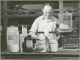 Dr. J.A. Schultz doing research on protein value of a hybrid corn, 1942