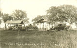 People and cars at tourist camp, Spicer, Minn., July 16, 1930