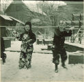 Small children playing in the snow, The University of Iowa, January 1938