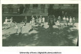 Women in Greek costume dancing on the Pentacrest lawn, The University of Iowa, 1920
