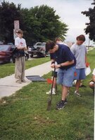 Tyler Bickel prepares to dig a hole for a tree to be planted in.