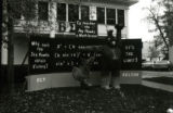 Homecoming lawn display of ""Cy Teaches the Jay Hawks a Math Lesson,"" 1977