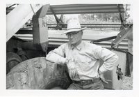 1964 - Clay Barnett Leans Against Tire