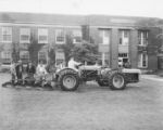 Ford tractors linked together, 1957