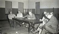 Seven Unidentified  Men Meet Around Table