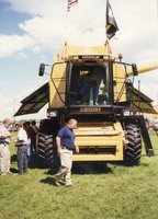 1997 District Conservationist J.B. Martin Sits in Caterpillar Combine at Ag Expo 1997