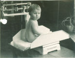 Measuring an infant's weight, The University of Iowa, 1920s