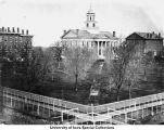 Pentacrest buildings and boardwalk, The University of Iowa, ca. 1869