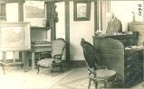 Man reading in Cumming Studio in the Physics Building, The University of Iowa, 1900s