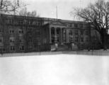 Curtiss Hall front (west) façade viewed from snowy central campus, 1956