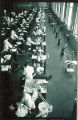 Dental students with patients in the infirmary clinic, The University of Iowa, 1940s