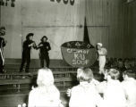 Alpha Delta Pi and Tau Kappa Epsilon performing a skit on the night before Homecoming, 1969