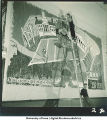 Students with modern art wall hanging, The University of Iowa, March 4, 1940