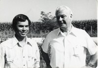 1970s Howard Bright and another unidentified man stand in a field