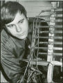Researcher examining equipment, 1973