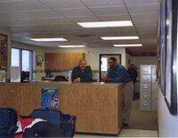 2003  Keosauqua District Conservationist Les Betts and Burlington District Conservationist Terrance Rudolph talk in office