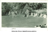 Women in costume dancing outside with large scarves, The University of Iowa, June 1924