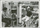 Thomas D. Wheelock and researchers study apparatus.